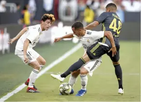  ?? AP ?? Matheus Pereira ( right) of Juventus vies for the ball with Real Madrid’s Lucas Vazquez ( centre) and Alvaro Odriozola in the Internatio­nal Champions Cup tournament at Landover on Saturday. Real Madrid won 3- 1. —