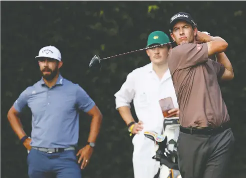  ?? ROB CARR / GETTY IMAGES ?? Australia's Adam Scott, with Erik van Rooyen of South Africa looking on, has never fired a practice shot for the Masters during the second week
of November, but that's 2020. The revered golf major will finally get its time in the sun this year, just with a much later tee time.