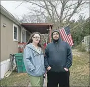  ??  ?? “THE OWNERS just seem to want to get every dime from us,” said Jessica Boudreaux, 33, standing with boyfriend Cory Keith in front of their mobile home.