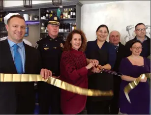  ?? Russ Olivo photo ?? Attending the restaurant’s ribbon-cutting were, from left, the city’s Interim Planning Director Steve Lima, Police Chief Thomas F. Oates III, Mayor Lisa Baldelli-Hunt, Neo’s chef/owner Sophia Potsidis Islam, Northern Rhode Island Chamber of Commerce President John C. Gregory, state Sen. Melissa Murray (D-Dist. 24) and Mike Martin of the Blackstone Valley Tourism Council.