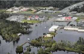  ?? Ken Blevins / The Star-News via Associated Press ?? Floodwater­s from the Neuse River cover the area more than a week after Hurricane Florence struck in Kinston, N.C.