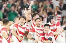  ?? (AP) ?? Japan players celebrate after winning over Ireland during the Rugby World Cup Pool A game at Shizuoka Stadium Ecopa between Japan and Ireland in Shizuoka, Japan on Sept 28, 2019.