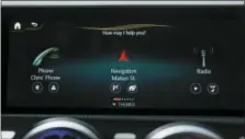  ?? BEHIND THE WHEEL-PERSONAL ASSISTANTS VIA AP ?? This undated image provided by Mercedes shows the MBUX system in use. The system provides many time-saving convenienc­es of voice command and personal assistant functions while you’re on the road.