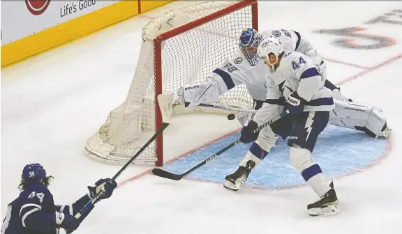  ?? JOHN E. SOKOLOWSKI/USA TODAY SPORTS FILES ?? Maple Leafs forward Auston Matthews scores one of Toronto's five goals Monday on Tampa Bay Lightning goaltender Andrei Vasilevski­y.