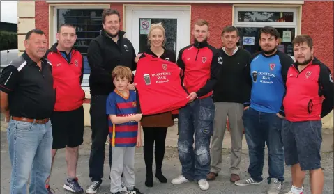  ??  ?? Pictured outside Porter’s Bar, Killenagh for the presentati­on of jerseys to Killenagh Wanderers first and second teams; first team manager, David kinsella, asstd. manager, David Egan, prop. Porters bar, Simon Besanson his nephew, Christophe­r Besanson,...