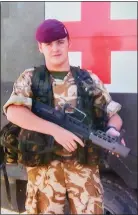  ??  ?? POSTER BOY: Corporal Paul Hartley pictured on duty in Afghanista­n in 2004