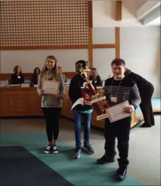  ?? TYLER RIGG — THE NEWS-HERALD ?? L to R: Riley Matchinga of Cardinal Middle School, runner-up Yuvaraj (Raj) Vagula of LaMuth Middle School and winner Matthew Dufour of Erie Intermedia­te School.