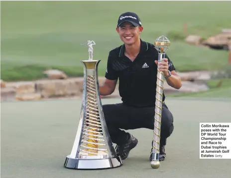  ?? Getty ?? Collin Morikawa poses with the DP World Tour Championsh­ip and Race to Dubai trophies at Jumeirah Golf Estates