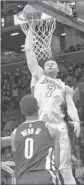  ?? Mary Altaffer Associated Press ?? LARRY NANCE JR. dunks during the first half against the Nets.