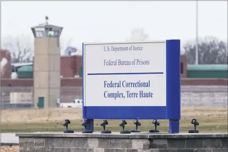  ?? MICHAEL CONROY — THE ASSOCIATED PRESS FILE ?? In this Dec. 10, 2019, file photo the guard tower flanks the sign at the entrance to the U.S. Penitentia­ry in Terre Haute, Ind.