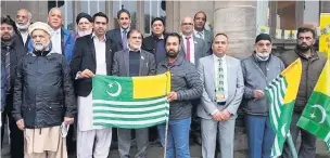  ??  ?? ●●The Kashmir flag-raising ceremony at Rochdale town hall.in November