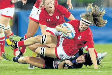 ?? SEAN KILPATRICK/THE CANADIAN PRESS ?? Canada’s Karen Paquin is tackled by Great Britain’s Alice Richardson during the bronze medal match in women’s rugby sevens at the 2016 Olympic Summer Games in Rio de Janeiro, Brazil on Aug. 8, 2016.
