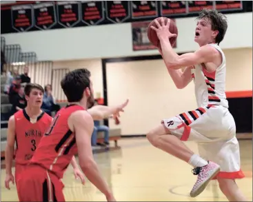  ??  ?? LaFayette junior Jon Morgan drives to the basket in the first half of the Ramblers’ state playoff game against North Oconee on Saturday night. Morgan had 21 points on the night, 16 coming in the first half. (Messenger photo/Scott Herpst)