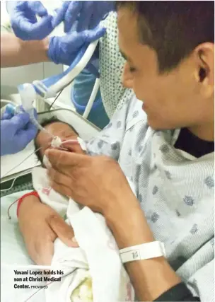  ?? PROVIDED ?? Yovani Lopez holds his son at Christ Medical Center.