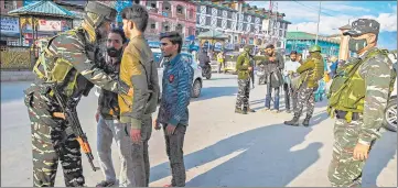  ?? AFP ?? Indian paramilita­ry troopers stop locals during a random search in Srinagar on Monday.