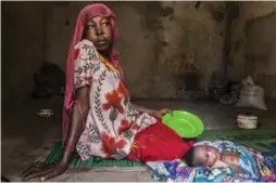  ?? JANE HAHN/FOR THE WASHINGTON POST ?? Hadiza Modu, 40, in a shelter in Banki, returned to Nigeria this year after a Boko Haram attack forced her to flee to Cameroon.