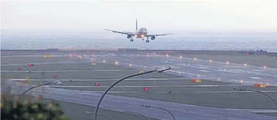  ?? Photo: KARL DRURY/FAIRFAX NZ ?? Rough ride: A plane lands at Wellington Airport during high winds – the consent process for a runway extension is bound to hit turbulence.