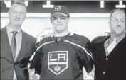  ?? Bruce Bennett Getty Images ?? ALEX TURCOTTE, center, was the prize of the 2019 draft for the Kings, who selected him fifth overall.