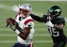  ?? FILe PhoTos ?? ‘SELLING MYSELF SHORT’: Patriots wideout Jakobi Meyers looks for an opening as Jets cornerback Pierre Desir closes in on Monday night in East Rutherford, N.J. Below, Cam Newton celebrates with Meyers after a successful two-point conversion against the Bills on Nov. 1.