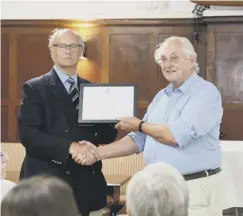  ?? PHOTO PETER JACKSON ?? Rev Brian Shersby receiving his RAFA Honorary Life Membership