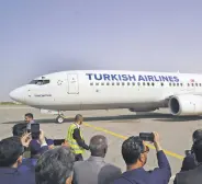  ?? ?? A Turkish Airlines aircraft is greeted after landing at the Mitiga Internatio­nal Airport, Tripoli, Libya, March 28, 2024.