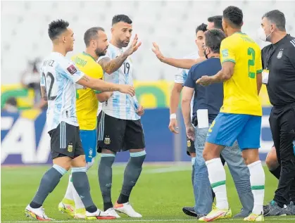  ?? Photo / AP ?? Players from Brazil and Argentina were left annoyed when health officials stopped their match.