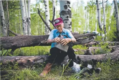  ??  ?? Emory Townsend, 93, stops for a lunch break with his dog, Molly, while delivering the mail last week. After 60 years of delivering mail, he says it is more of a vacation than a job. Photos by Gabriel Scarlett, The Denver Post