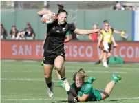  ?? AP ?? New Zealand’s Michaela Blyde (left) runs past Ireland’s Stacey Flood to score during the Women’s Rugby Sevens World Cup. —