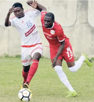  ?? FILE ?? Portmore United’s Roberto Johnson (left) challenges Boys Town FC’s Xavian Virgo for the ball during a Red Stripe Premier League match at the Spanish Town Prison Oval on Sunday, February 18, 2018.