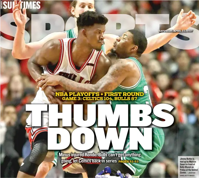  ?? | JONATHAN DANIEL/ GETTY IMAGES ?? Jimmy Butler is tied up by Marcus Smart in front of Kelly Olynyk on Friday at the United Center.