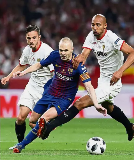  ?? — AP ?? Looking to bow out on a high: Barcelona’s Andres Iniesta (centre) will be at the centre of any celebratio­ns, with the Spaniard expected to announce his Barcelona departure in the coming days.