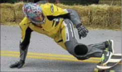  ?? KYLE MENNIG - ONEIDA DAILY DISPATCH ?? A skateboard­er goes into Crash Corner during Gravity Fest X in Munnsville on Saturday, Aug. 1, 2015.