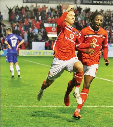  ??  ?? KILLER BLOW: Jason Demetriou celebrates hitting the winner for Walsall in stoppage time