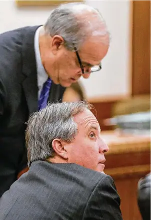  ?? Melissa Phillip / Houston Chronicle ?? The securities fraud case against Texas Attorney General Ken Paxton, front, shown with Phil Hilder, one of the attorneys representi­ng him, will be heard in a Houston courtroom.