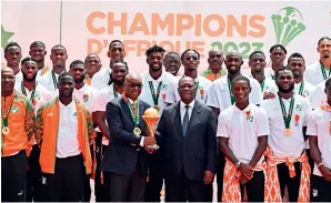  ?? ?? The Cote d’Ivoire national team is honoured by President Alassane Ouattara after their victory at the 34th edition of CAN on February