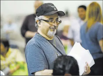  ?? ERIK VERDUZCO/LAS VEGAS REVIEW-JOURNAL / FOLLOW @ERIK_VERDUZCO ?? Daniel Quinones walks away with a smile after receiving $150 in utility bill relief at NV Energy’s Senior Energy Assistance Expo on Saturday at Cashman Center. “Every little bit helps,” Quinones said.