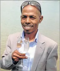  ?? Picture: DAVID MACGREGOR ?? SALTY TREAT: Former Ndlambe mayor Sipho Tandani toasts the success of his new bottled Port Alfred seawater business after receiving the thumbs up from provincial government