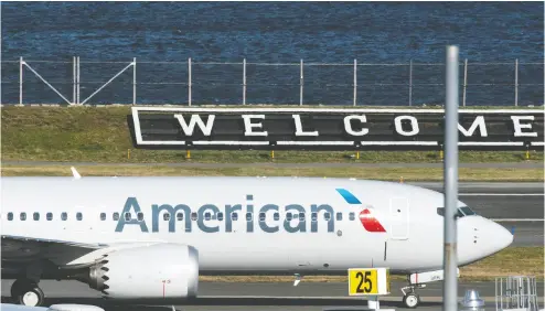  ?? Edua rdo Munoz / reuters ?? American Airlines flight 718 — the first U. S. Boeing 737 Max commercial flight since regulators lifted a 20-month
grounding in November — lands Tuesday at Laguardia airport in New York.