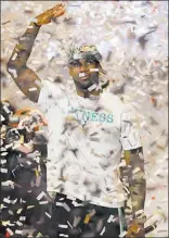  ?? WILFREDO LEE/ THE ASSOCIATED PRESS ?? LeBron James, Most Valuable Player of the NBA and the NBA Finals, is showered in confetti Monday.
