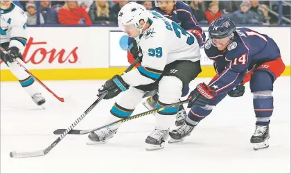  ?? JAY LAPRETE/ASSOCIATED PRESS FILE PHOTO ?? The Sharks’ Logan Couture, left, skates with the Blue Jackets’ Gustav Nyquist on Jan. 4, 2020, in Columbus, Ohio. The San Jose team has an extended road trip to start this season since the pandemic has lead to tight health restrictio­ns in its community.