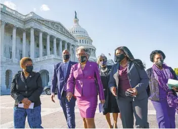  ?? J. SCOTT APPLEWHITE AP ?? Members of the Congressio­nal Black Caucus walk to make a make a statement on the verdict in the murder trial of former Minneapoli­s police Officer Derek Chauvin in the death of George Floyd on Tuesday. From left are Rep. Karen Bass, D-Los Angeles, Rep. Andre Carson, D-Ind.. Rep. Joyce Beatty, D-Ohio, Rep. Brenda Lawrence, D-Mich., Rep. Cori Bush, D-Mo., and Rep. Sheila Jackson Lee, D-Texas.