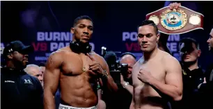  ?? Reuters ?? Anthony Joshua and Joseph Parker pose for the cameras during the weigh-in ceremony. —