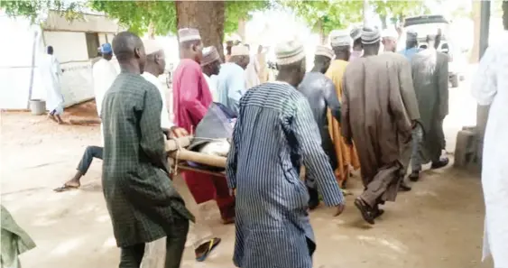  ?? Photo: Shehu Umar ?? Funeral rite for one of the victims in Shinkafi town yesterday
