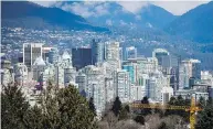  ?? DARRYL DYCK / THE CANADIAN PRESS FILES ?? Vancouver, pictured, and Toronto have had the two tightest downtown office-vacancy rates for four quarters in a row.