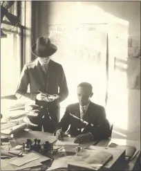  ??  ?? A Royal Oak Tribune reporter, A.W. Robinson, interviews Royal Oak City Manager Raymond Whitney in his office at City Hall, located on the corner of Troy and Second streets, sometime after Whitney took the job in 1924.