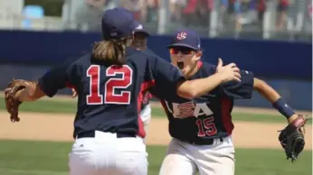  ?? RICHARD LAUTENS/TORONTO STAR ?? Americans Stacy Piagno, left, and Jade Gortarez celebrate taking down Canada to win gold in Pan Am baseball.