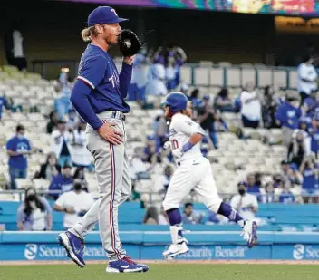  ?? Mark J. Terrill / Associated Press ?? Mike Foltynewic­z gave up home runs to three of the first seven batters during the Rangers’ 16th road straight loss, a 12-1 beatdown at Los Angeles on Friday, as they draw closer to the MLB record of 22 in a row.