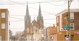  ?? MATT ROURKE/AP ?? A Philadelph­ia historical panel Friday recommende­d demolition of the two spires of the shuttered 19th-century St. Laurentius Roman Catholic church.