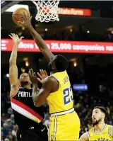  ?? RAY CHAVEZ — STAFF PHOTOGRAPH­ER ?? The Trail Blazers’ CJ McCollum finds his path to the basket blocked by Draymond Green on Thursday.