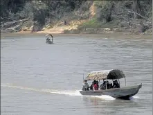  ?? EDUARDO VERDUGO / AP ?? Migrants cross from Guatemala into southern Mexico’s Chiapas state.